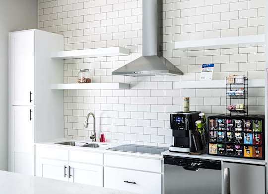 Leasing Center clubhouse modern kitchen at Whitehall Estate apartments in Charlotte NC