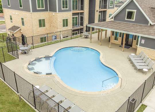 Aerial view of pool and float deck with lounge chairs