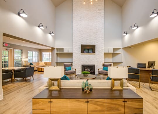 A modern living room with a fireplace and a coffee table.