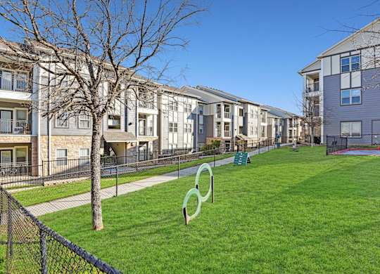 the preserve at ballantyne commons yard with grass and apartment buildings