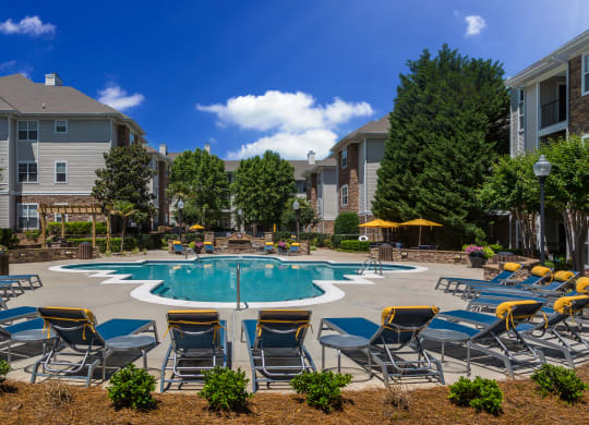 Pool area with lounge chairs