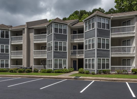 Duluth, GA Pet-Friendly Apartments - The Eclipse - Property Exterior with Private Patios/Balconies, Big Windows, and Maintained Landscaping