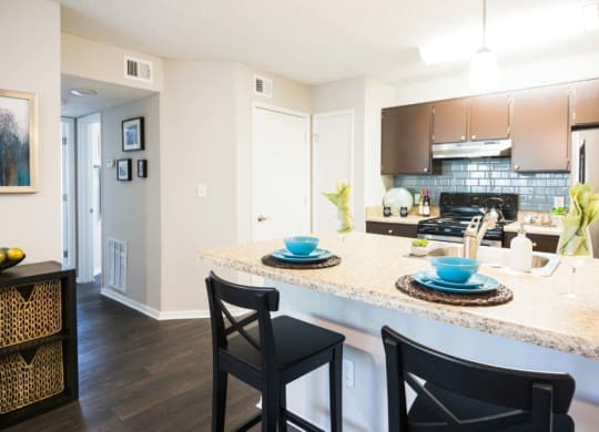a kitchen with a plates and cups on a counter top at Eclipse Duluth