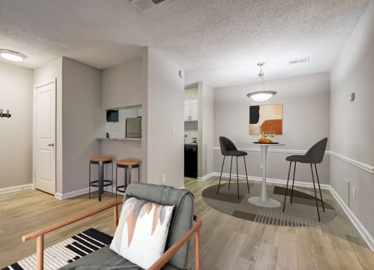 a living room and kitchen with a bar and a couch