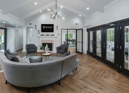 Veridian at Sandy Springs apartments clubhouse interior filled with furniture and a fire place