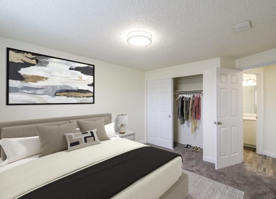 a bedroom with a large bed and a walk in closet