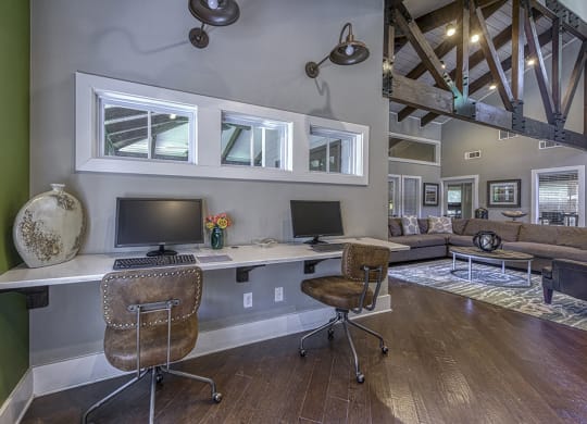 office computers station with two desks and two computer monitors at Wynnwood Vinings Leasing center Tamarron Pkwy SE Atlanta GA