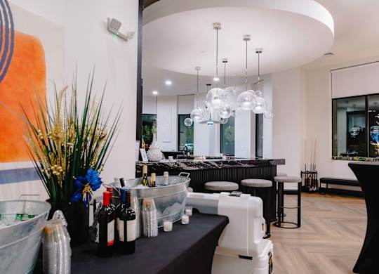 A modern bar area with a black counter at Metro 303, Hempstead, NY, 11550