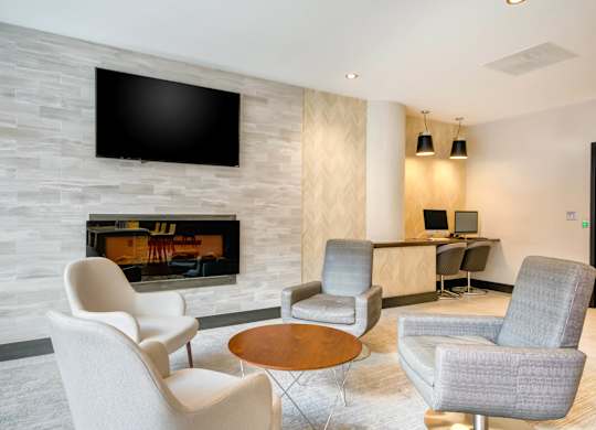Clubroom With TV And Fireplace at 222 Saratoga, Baltimore, MD 21202
