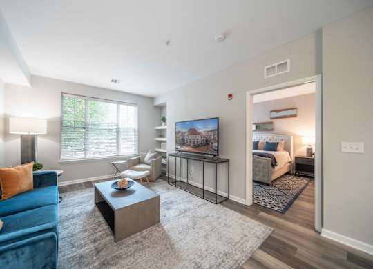 a spacious living room with a large window at Harbor Pointe, Bayonne, New Jersey