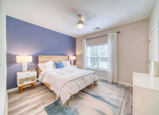 a bedroom with a bed and a window at Meridian Obici, Suffolk Virginia