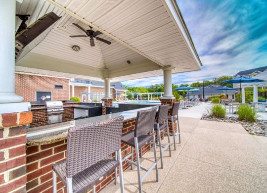 Poolside grilling station with TV at Meridian Obici, Virginia