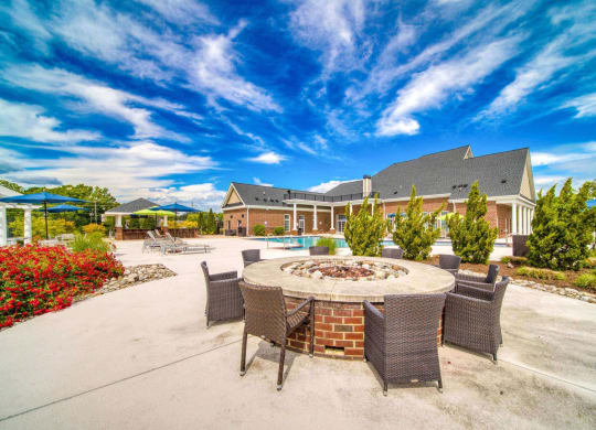 A large pool with a fire pit at Meridian Obici, Suffolk Virginia