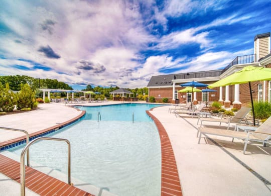 a large swimming pool with sun shelf at Meridian Obici, Suffolk Virginia