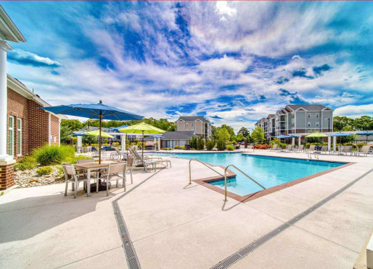 a large swimming pool with sun shelf at Meridian Obici, Suffolk, VA