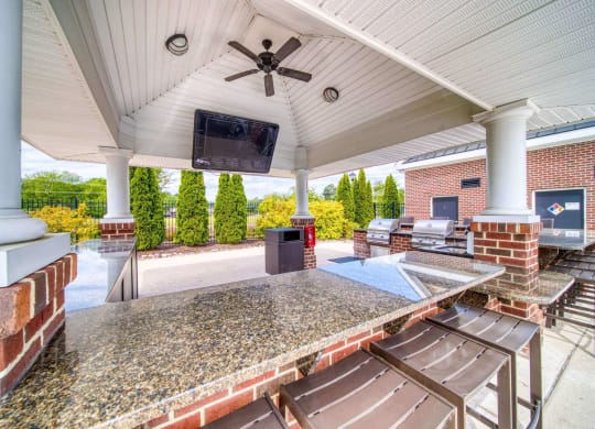 Poolside grilling station with TV at Meridian Obici, Virginia