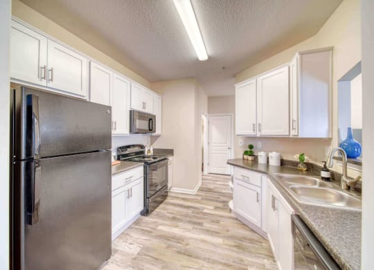 a kitchen with stainless steel appliances at Meridian Obici, Suffolk