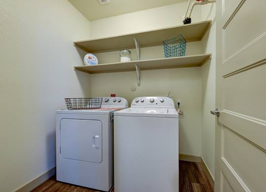 White machines in laundry room at Agave, San Antonio, TX