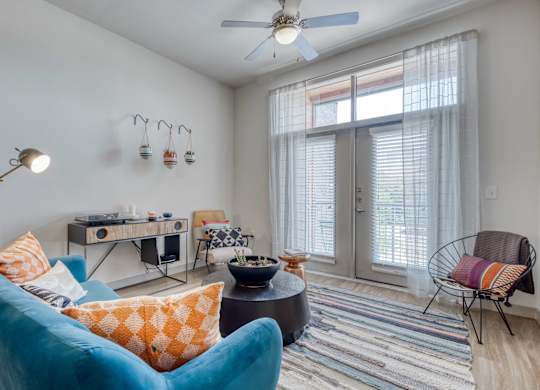 Living Room with blue chair at Agave, San Antonio