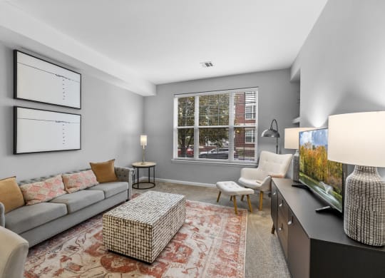 a spacious living room with a large window  at Harbor Pointe, Bayonne, New Jersey