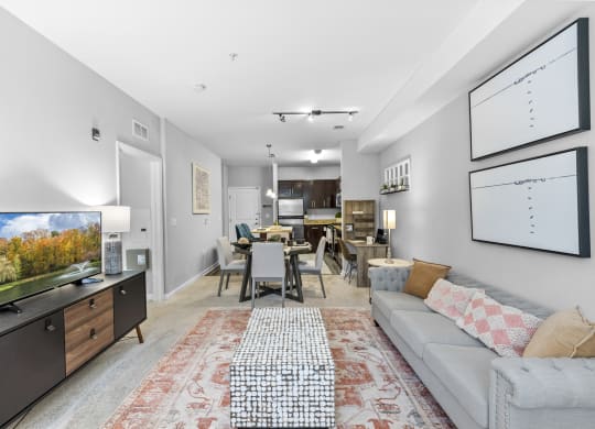 a living room with a couch and a tv at Harbor Pointe, Bayonne, New Jersey