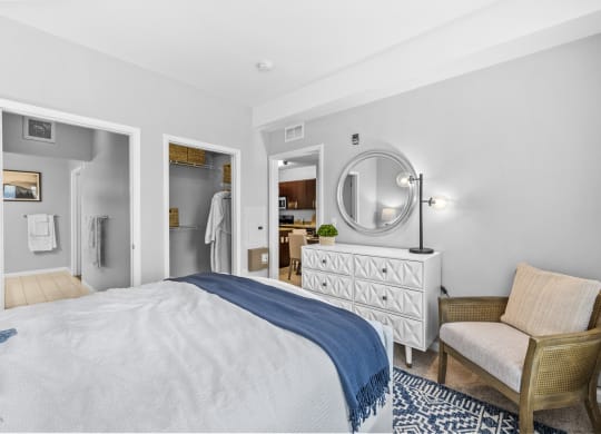 a bedroom with a bed and a chair  at Harbor Pointe, New Jersey