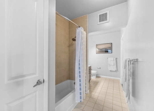 a bathroom with a shower and a toilet at Harbor Pointe, New Jersey, 07002