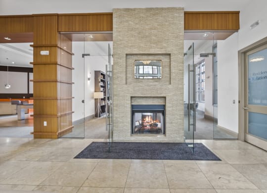 a fireplace in the center of the lobby  at Harbor Pointe, New Jersey, 07002