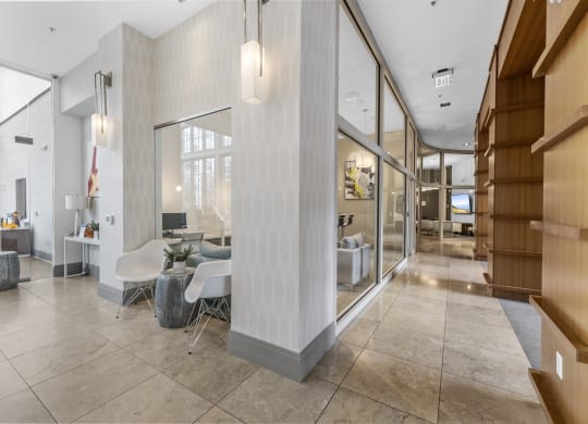 Hallway to Gym, Business Center, Game Room, and The Clubhouse with a pool table, entrance to outdoor pool, a bar and kitchen at Harbor Pointe, New Jersey, 07002