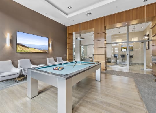 The Clubhouse with a pool table, entrance to outdoor pool, a bar and kitchen at Harbor Pointe, New Jersey, 07002