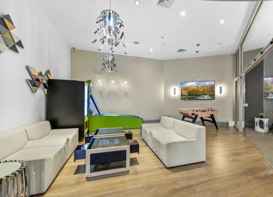 a games room with a foosball table and mini bowling at Harbor Pointe, Bayonne
