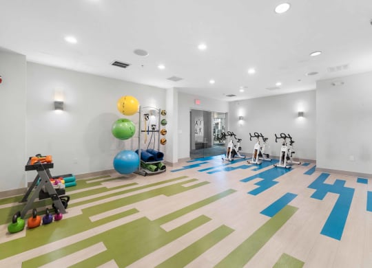a spacious fitness center with treadmills and other exercise equipment  at The Lena, New Jersey