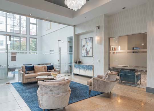 A spacious living room with a large sofa set and a television at Harbor Pointe Apartments, New Jersey