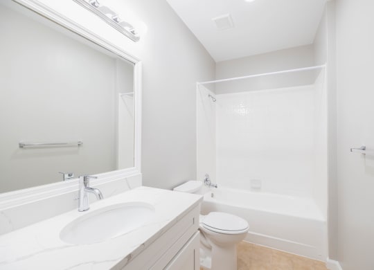 a bathroom with a sink toilet and a bath tub at The Lena, Raritan, NJ 08869