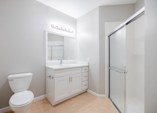 a bathroom with a toilet and a sink and a shower at The Lena, Raritan, NJ 08869