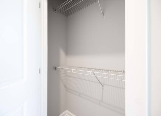 Empty white shelves in a white room.