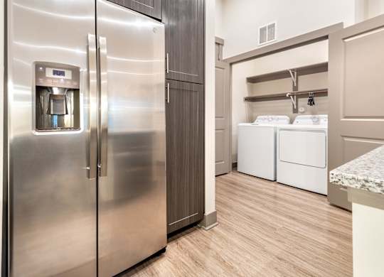 Kitchen and laundry at The Bridge at McKinney, McKinney Texas