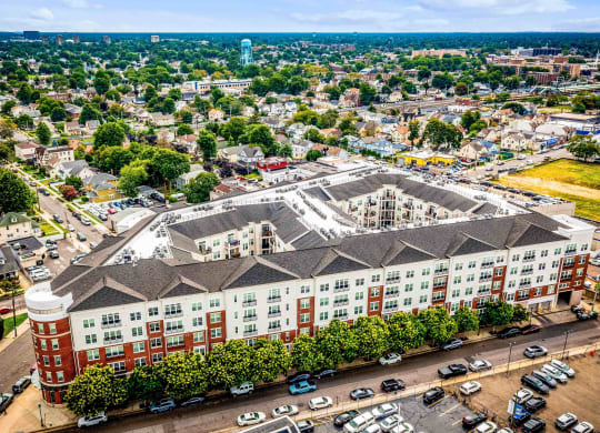 an aerial view of a large building in a city at Metro 303, Hempstead, NY