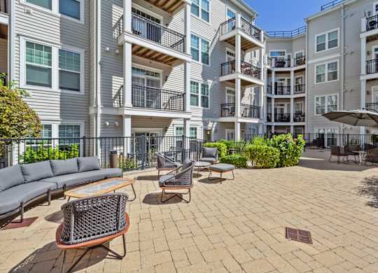 Seating in outdoor courtyard area at Metro 303, Hempstead, NY, 11550