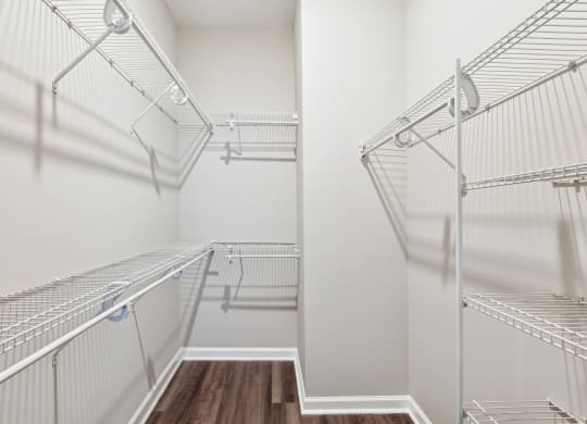 a spacious walk in closet with stainless steel shelves at Metro 303, Hempstead New York