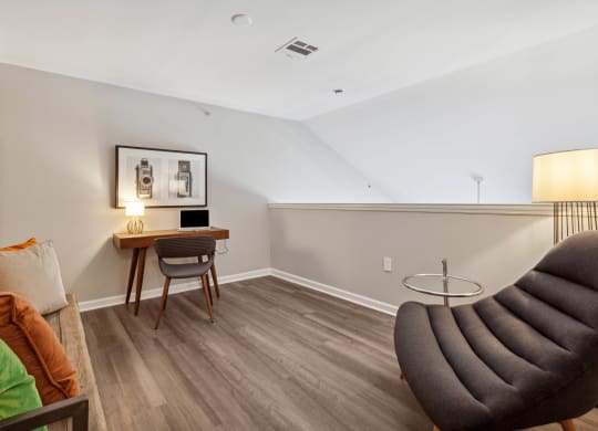 a bedroom with a desk and chair in a 555 waverly unit at Metro 303, Hempstead