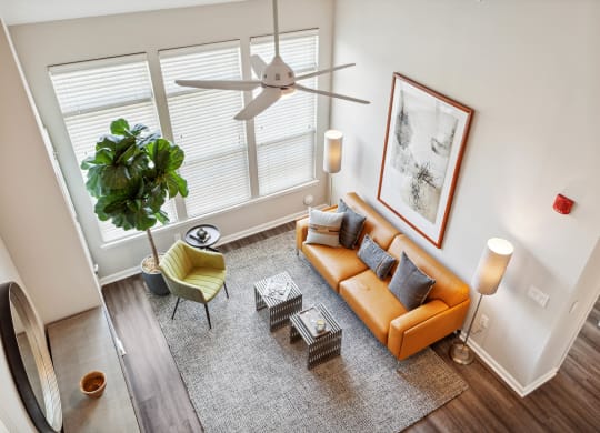 an overhead view of a living room with a couch and chairs at Metro 303, New York