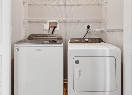 a small laundry room with a washer and dryer at Metro 303, New York, 11550