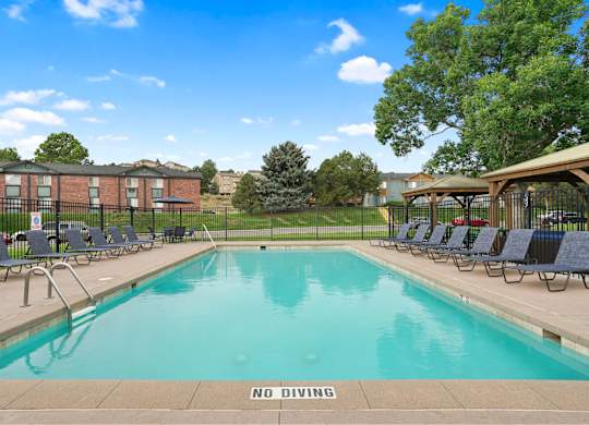 A pool with a NO DIVING sign in the foreground at Mountain Vista Apartments, Colorado, 80228