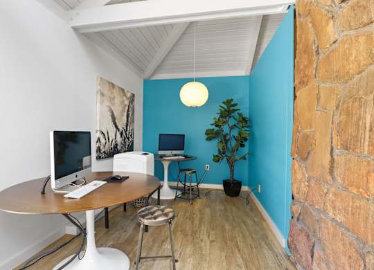 A room with a desk and a computer monitor at The Ranch at Bear Creek Apartments, Colorado
