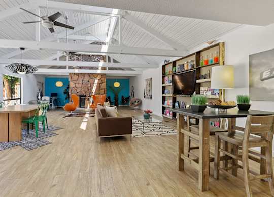 A living room with a wooden floor and a ceiling fan at The Ranch at Bear Creek Apartments, Lakewood, 80227