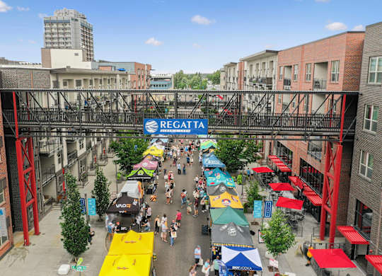 A busy street with a sign at Regatta Sloans Lake Apartments, Denver