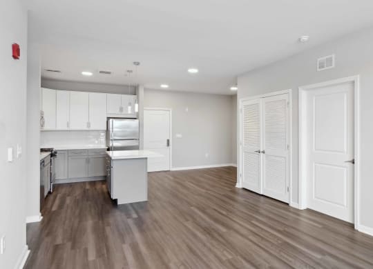 a kitchen and living room in a 555 waverly unit at Metro 303, New York, 11550