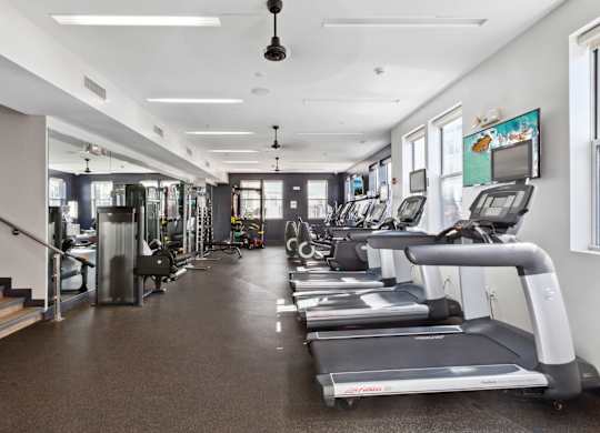 Fitness Center with treadmills and a TV at West 130, West Hempstead, 11552