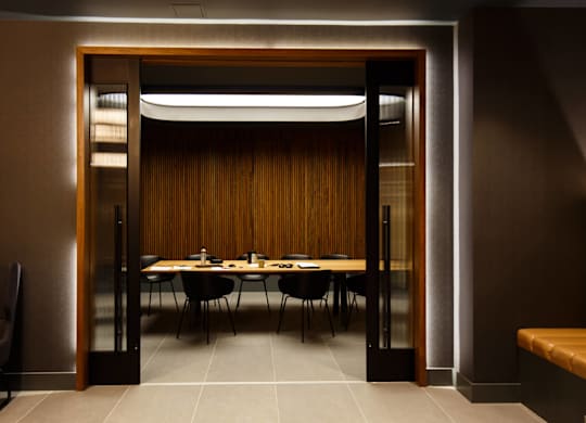 a dining room with a table and chairs